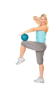 Woman practises with a blue ball